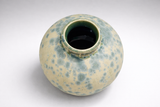 Top-down view of moon jar vase opening with glossy green-blue liner glaze and crystalline pattern around the neck