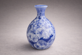 Side view blue crystalline glaze bud vase, glossy handmade pottery, studio product photo