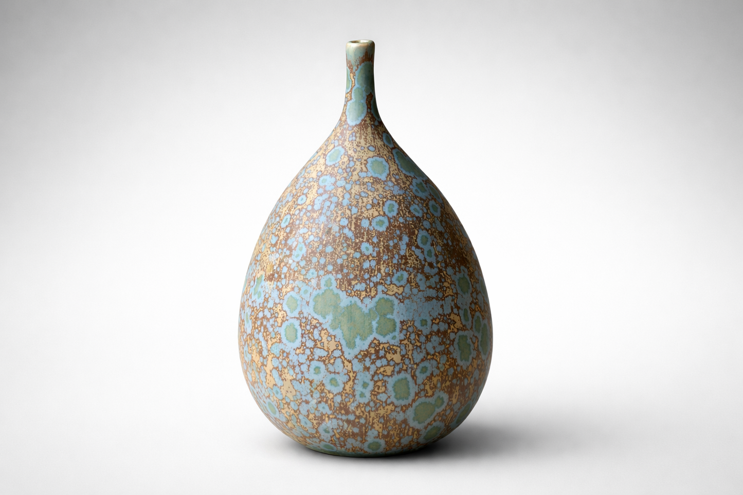 Teardrop-shaped handmade ceramic vase with matte blue-green crystalline glaze finish