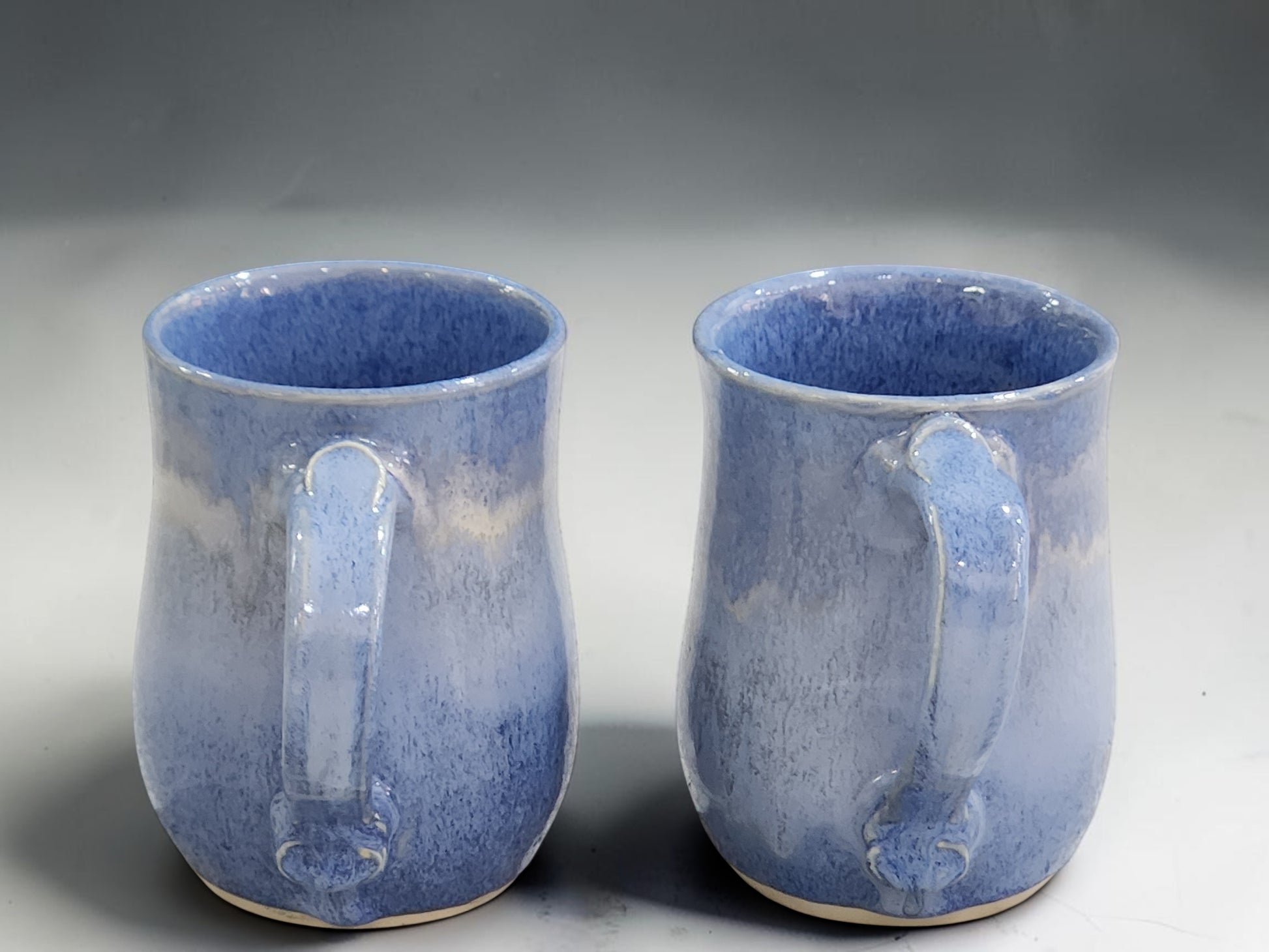 Large Handmade stoneware coffee mug with blue variegated glaze