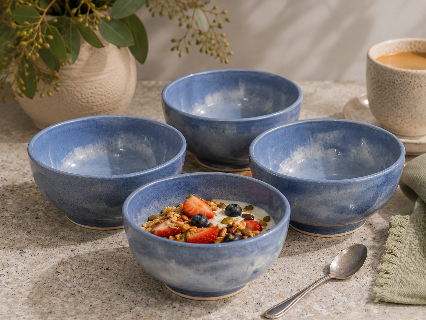 Set of four handmade blue ceramic cereal bowls by Buxton Pottery