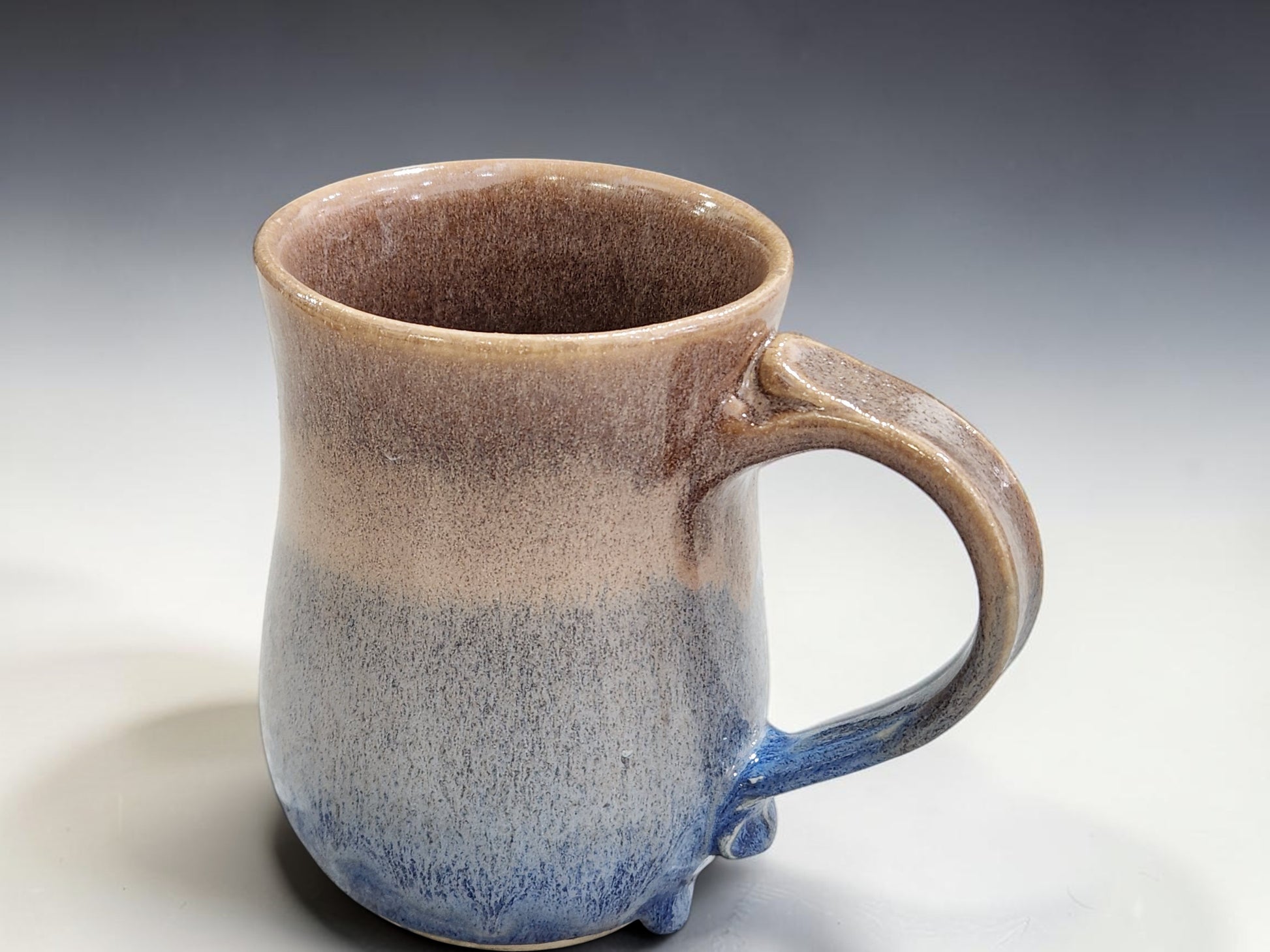 One-of-a-kind handmade pottery mugs in soft blue and oatmeal glaze for coffee or tea