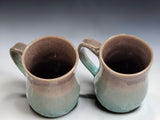 Australian handmade ceramic coffee mugs with flowing blue and brown glaze finish
