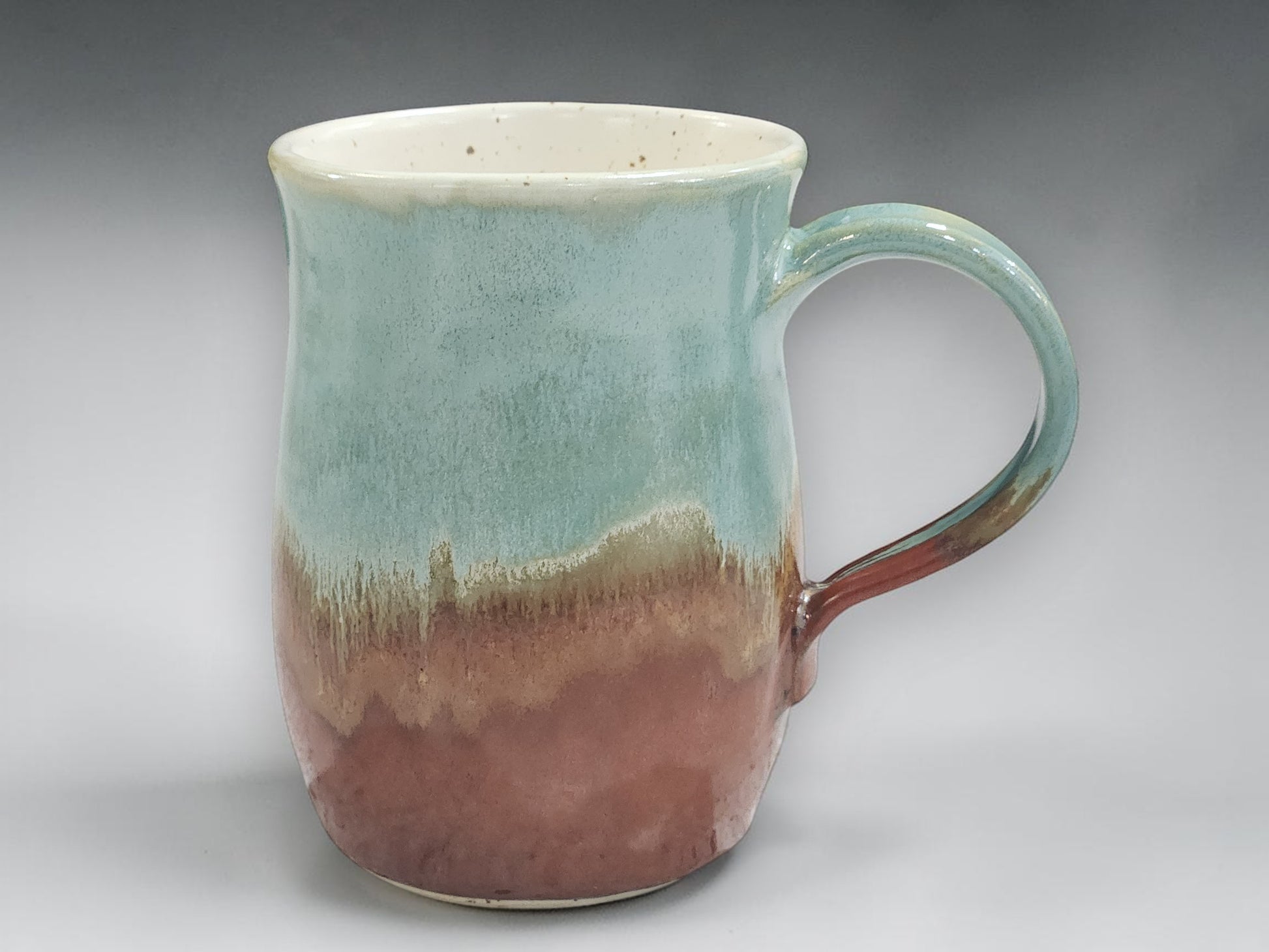 One of a kind handmade pottery mug in natural glaze tones