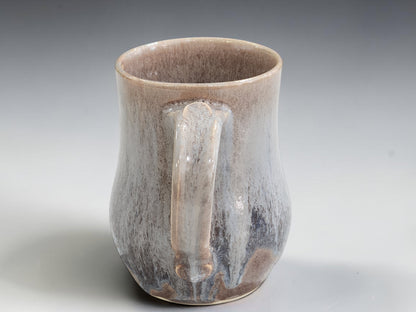 Tall rounded ceramic mug with comfortable loop handle