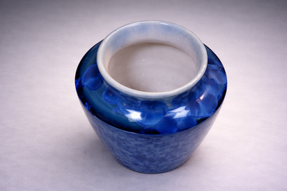 Decorative handmade ceramic vase in rich blue crystalline glaze