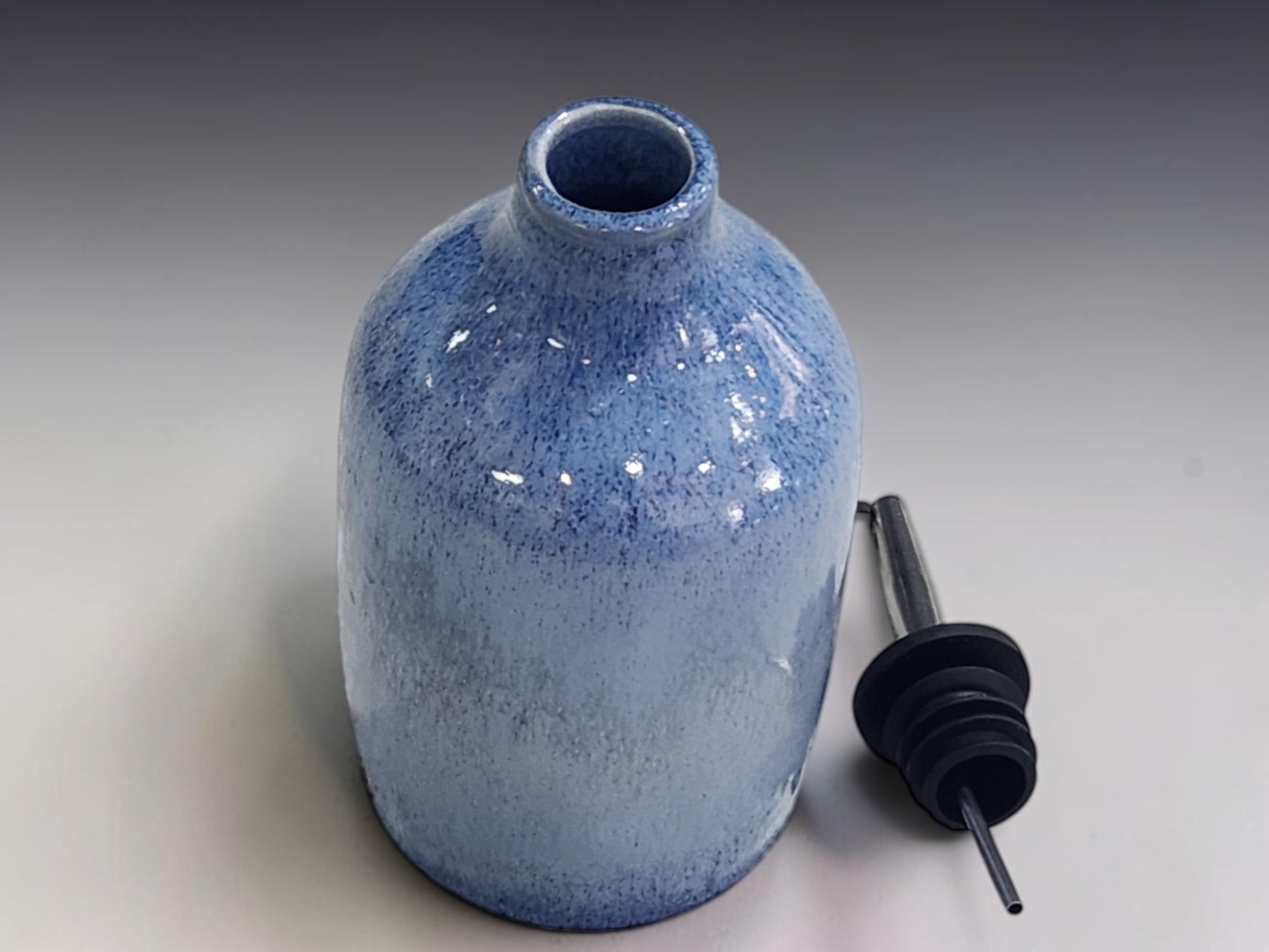 Handmade pottery olive oil cruet in blue glaze, functional ceramic bottle for everyday use