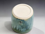 Small handmade stoneware tumbler in soft mist green glaze, a unique Australian pottery gift