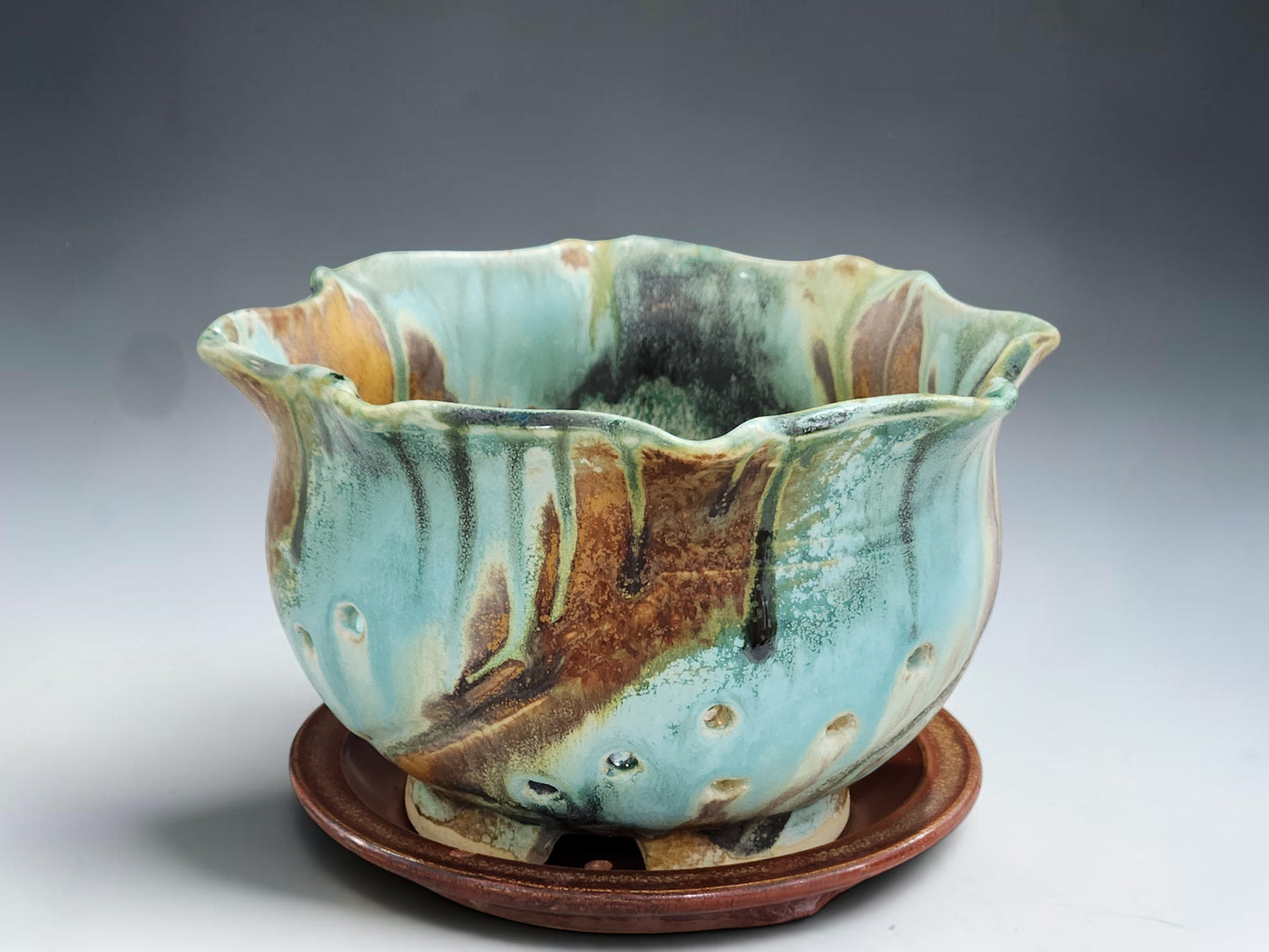 Handmade ceramic berry bowl with drainage holes and matching saucer, crafted by Buxton Pottery in Melbourne Australia