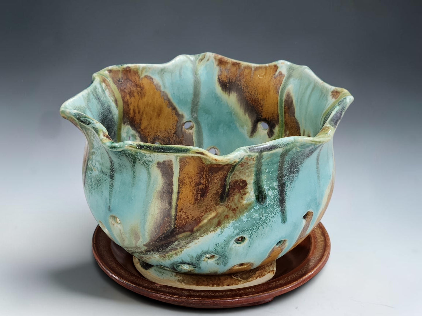 Australian handmade ceramic berry bowl with terracotta saucer and flowing turquoise green glaze