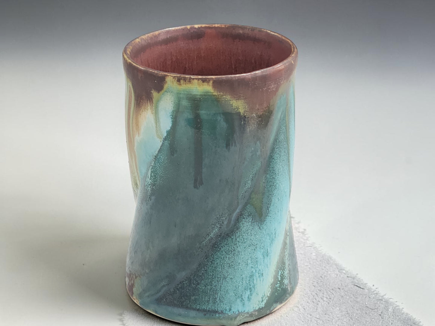 Handmade pottery coffee mug with turquoise, earthy brown and cream flowing glaze from the Bush Creek Earth Collection