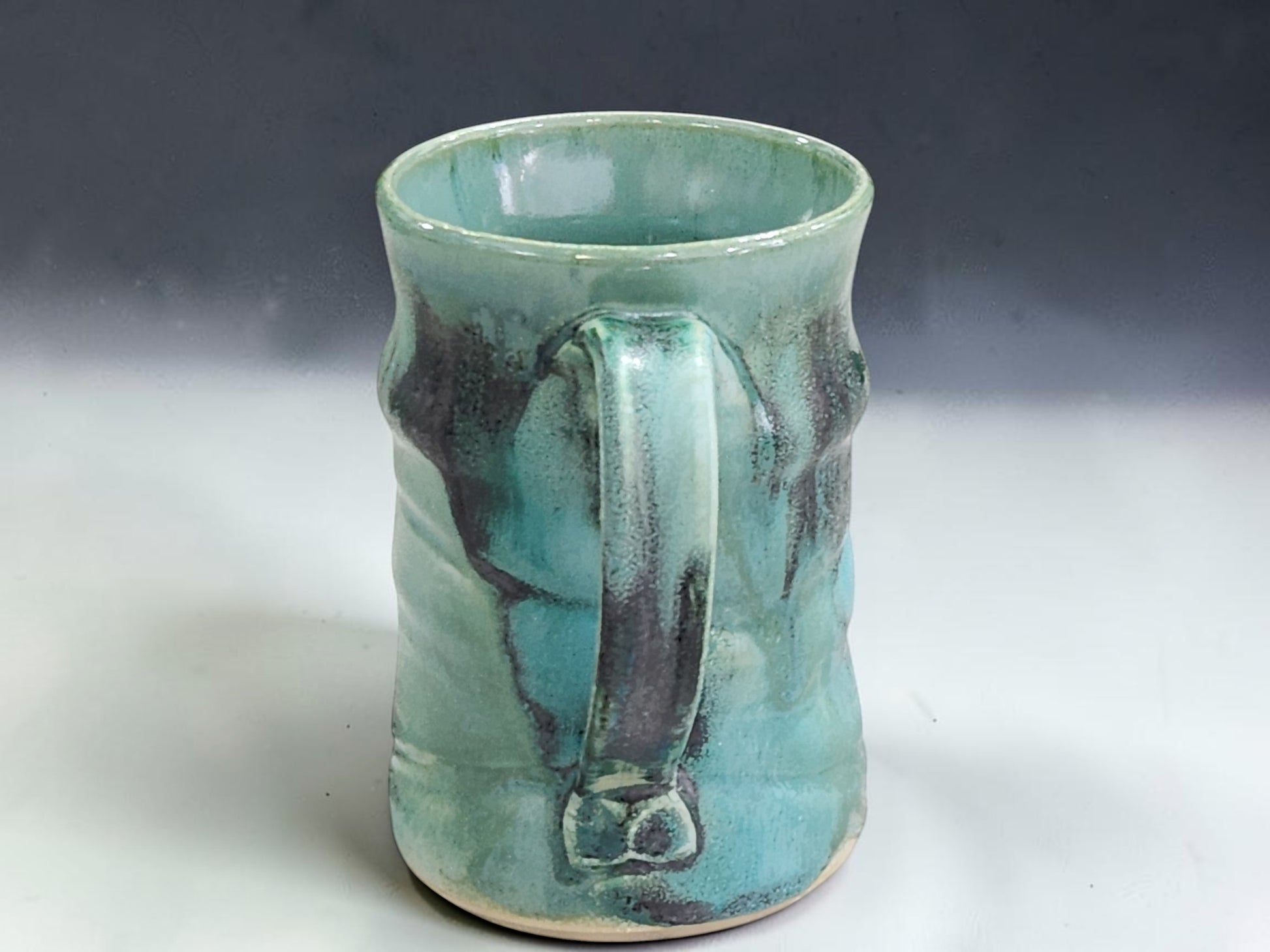 Buxton Pottery handmade mug with French coffee press, pastry and warm natural light kitchen styling