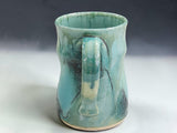 Australian handmade pottery mug with unique green blue glaze movement and textured handmade form