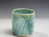 Handmade stoneware tumbler in soft green and aqua glaze, wheel-thrown by Buxton Pottery in Melbourne Australia