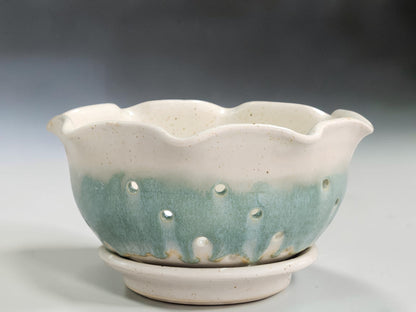 Handmade ceramic berry bowl filled with fresh strawberries