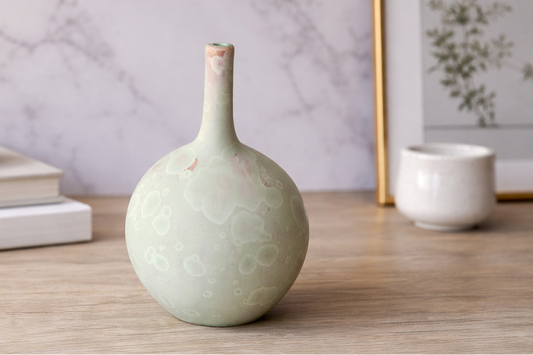 14 cm mint green crystalline display vase on a timber table, made in Buxton Pottery's Melbourne studio.