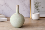 14 cm mint green crystalline display vase on a timber table, made in Buxton Pottery's Melbourne studio.