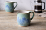 Handmade ceramic milk jug in soft green and blue stoneware glaze, 200ml