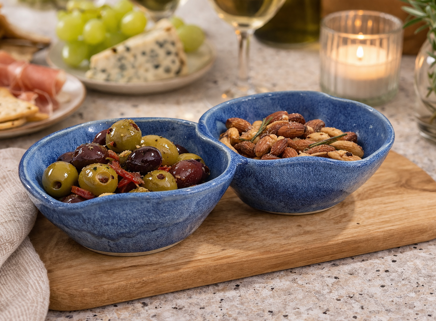 Handmade blue ceramic double snack bowl with two connected sections