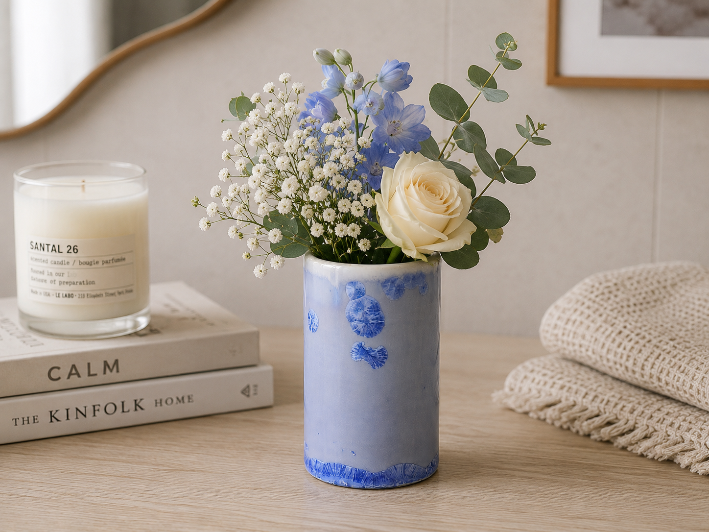 Handmade ceramic crystalline blue bud vase .