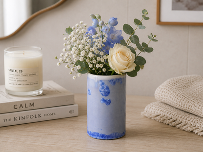 Handmade ceramic crystalline blue bud vase .