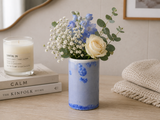 Handmade ceramic crystalline blue bud vase .