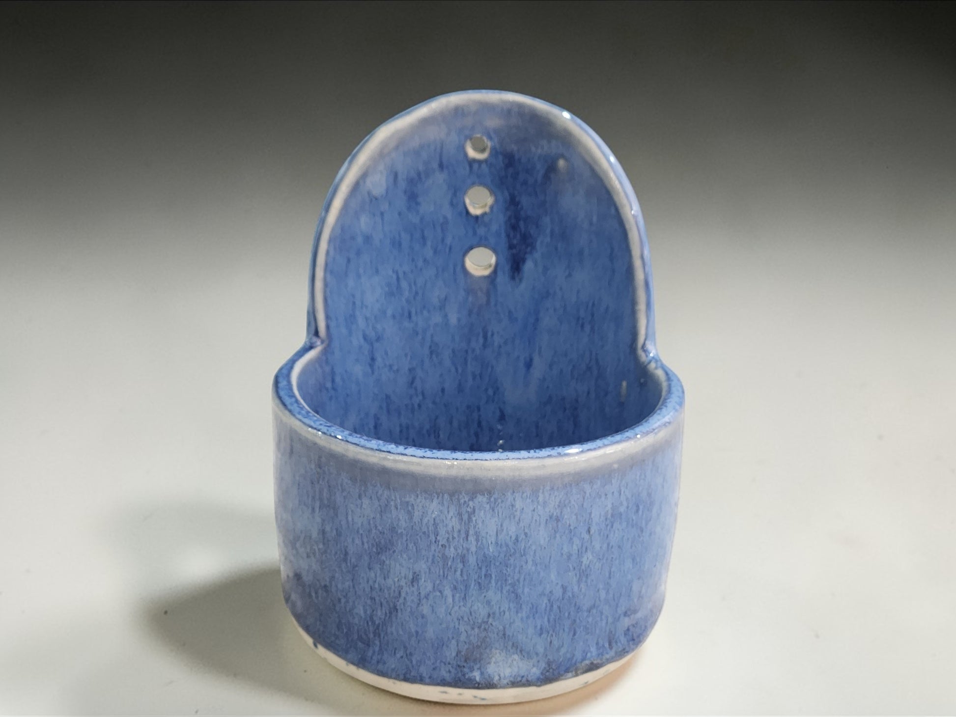 Artisan pottery herb stripper in blue glaze for kitchen use