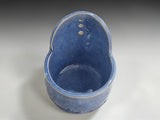 Interior of Australian handmade pottery herb stripper in soft blue glaze