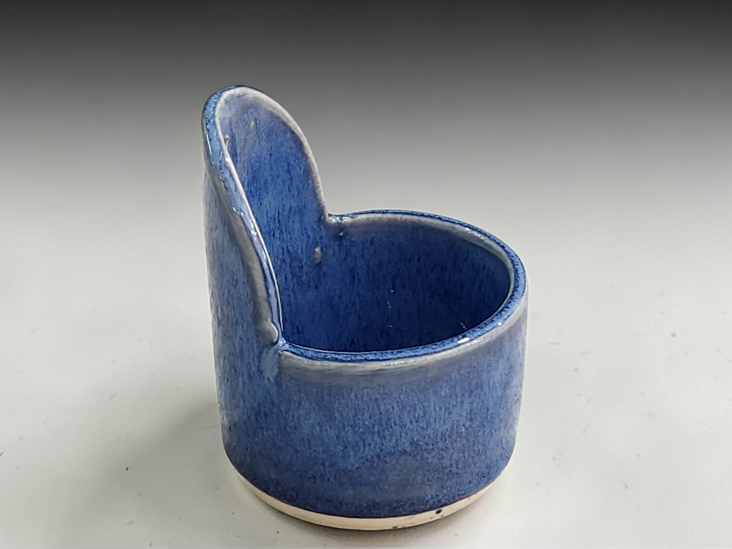 Unique blue ceramic herb stripper for stripping fresh herbs.