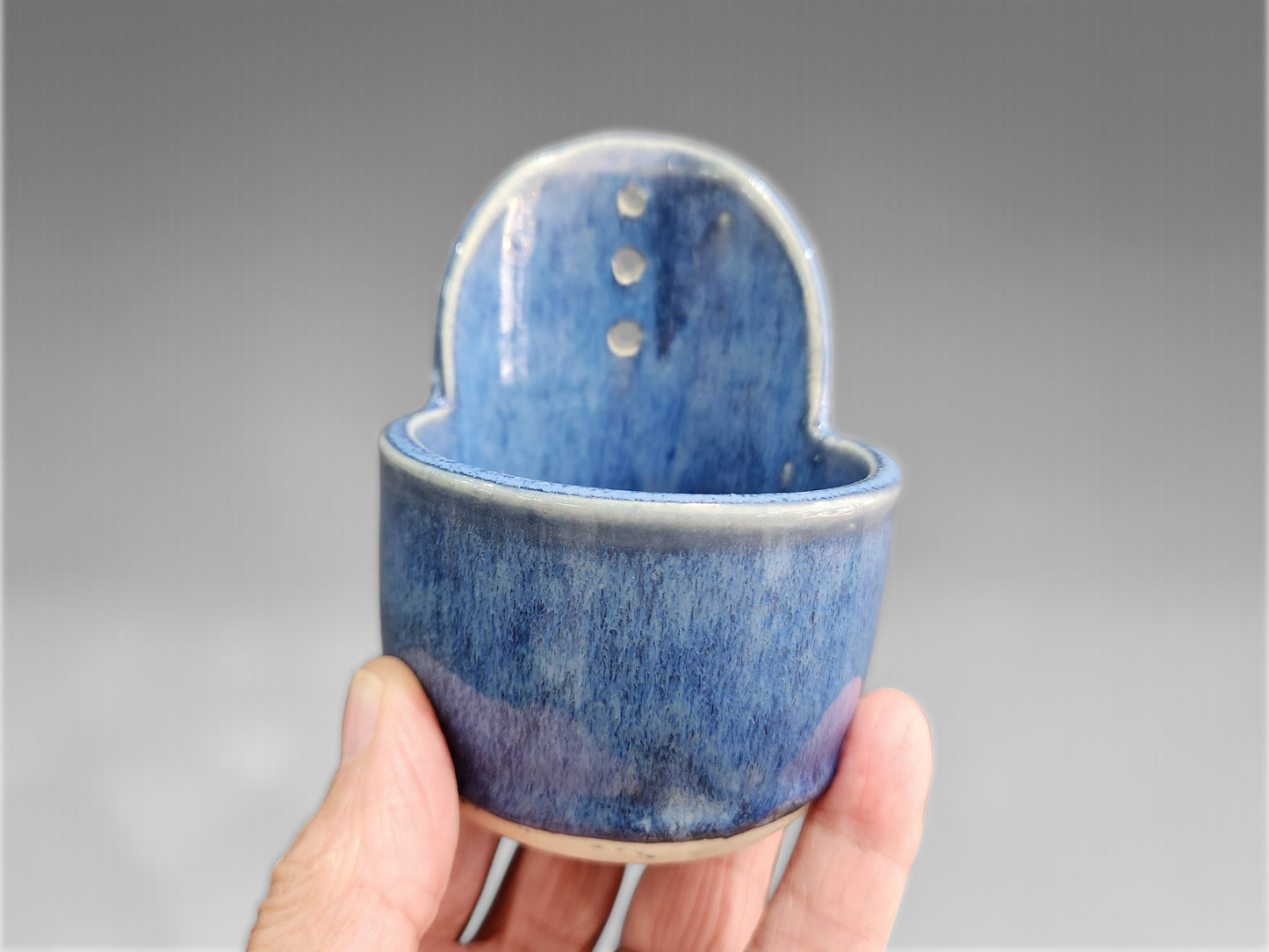 Handmade blue ceramic herb stripper with rosemary stem