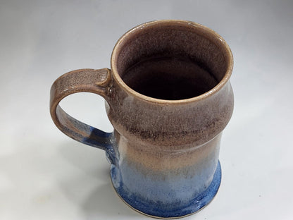 Blue and oatmeal pottery stein with large curved handle