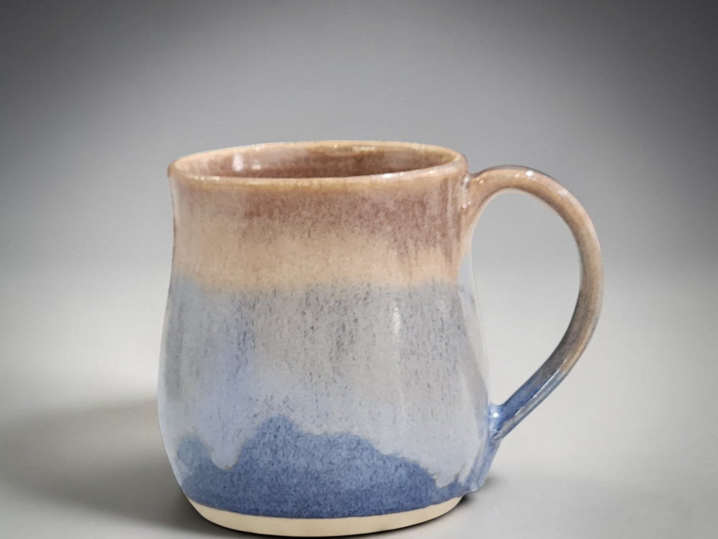 Handmade ceramics mug showing side profile and curved handle