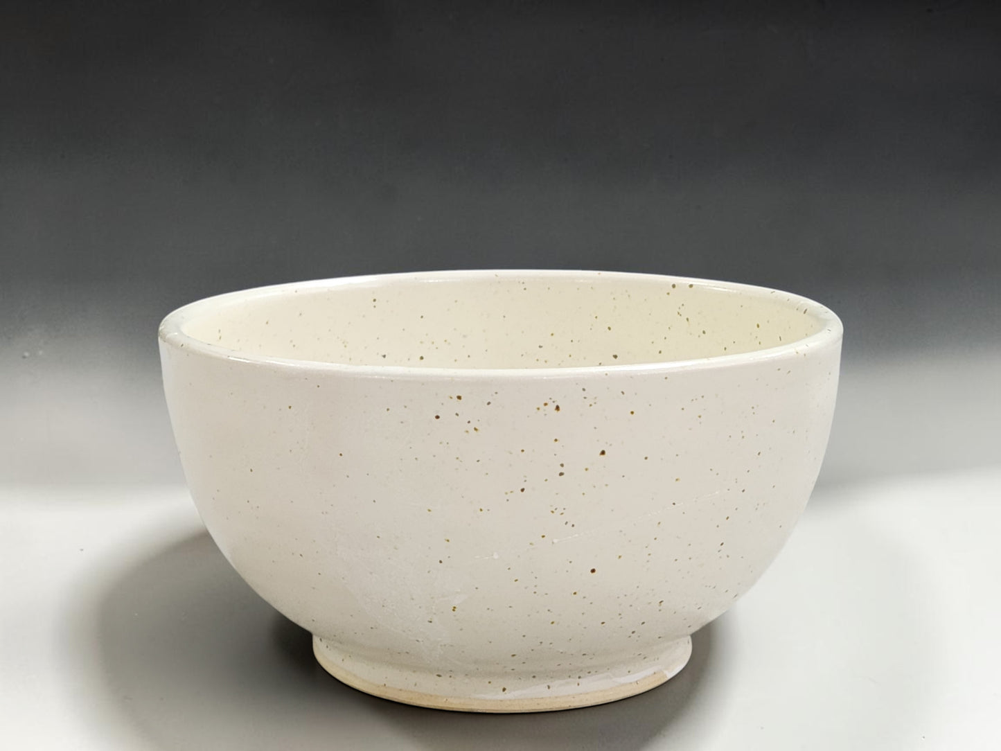 Handmade ceramic noodle and rice bowl with timeless neutral speckled glaze