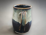 Buxton Pottery handmade mug in Tenmoku and cream