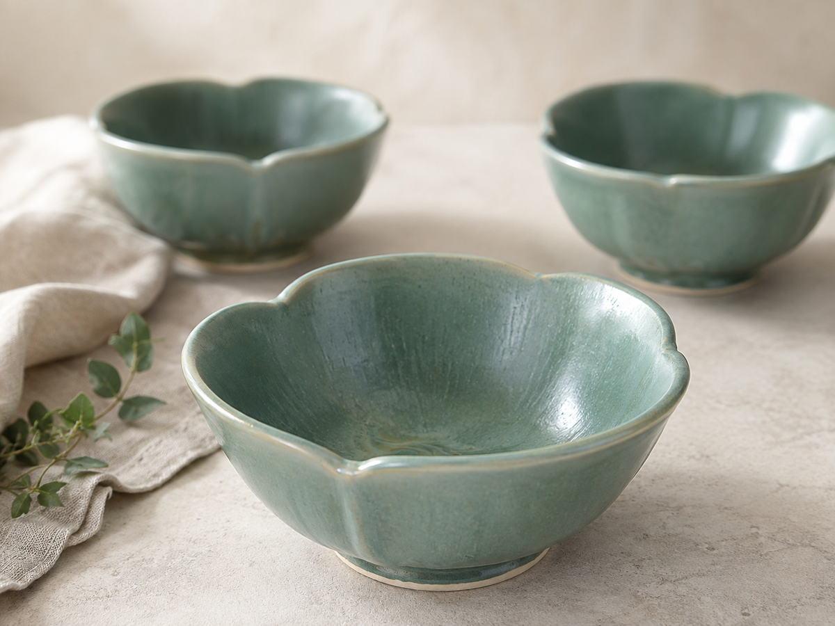 Handmade altered ceramic bowls in seafoam green glaze, crafted by Buxton Pottery in Melbourne Australia