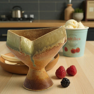 Footed base elevates the bowl form visually and literally