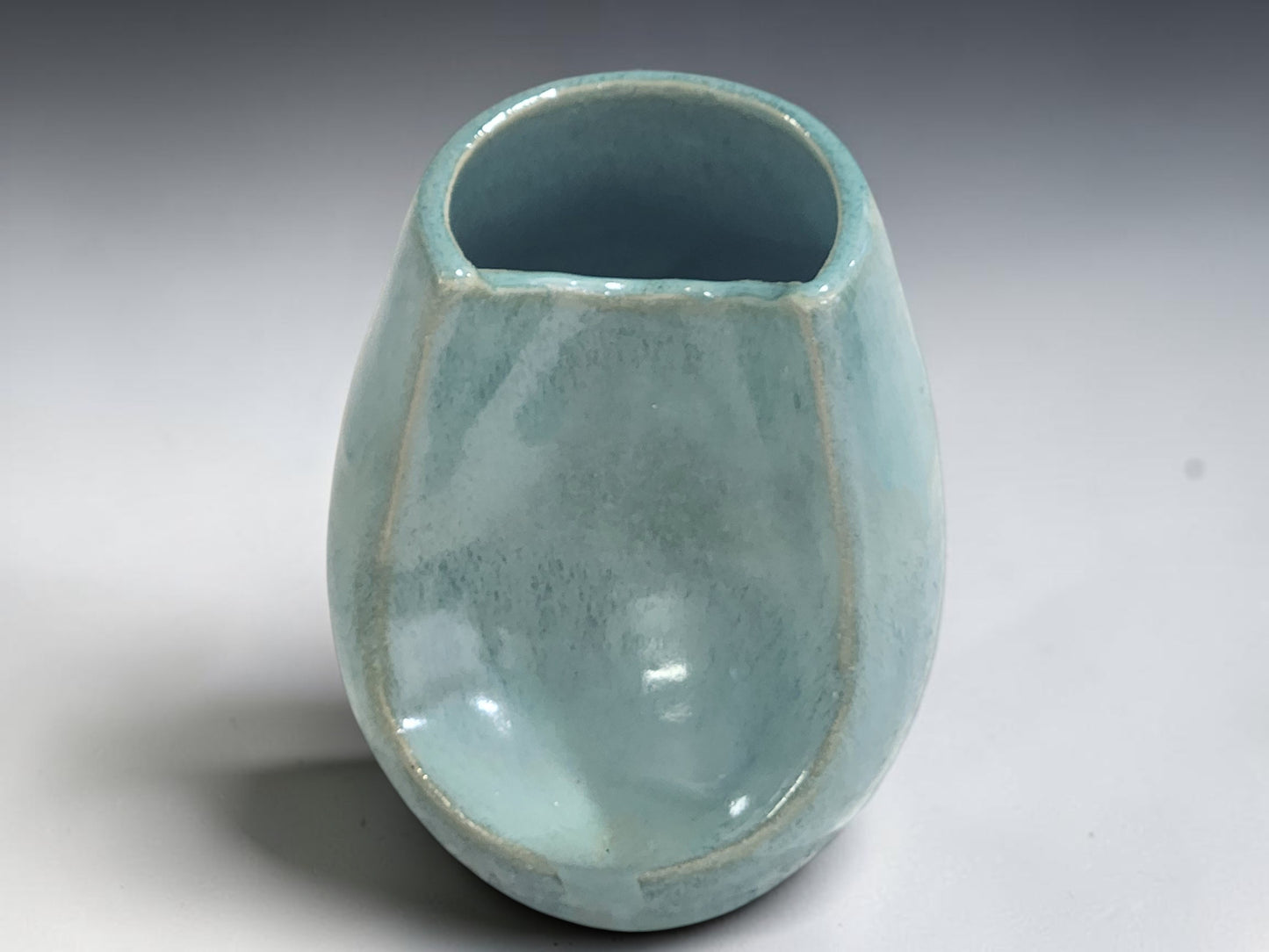 Contemporary handmade Australian pottery vase in seafoam glaze.