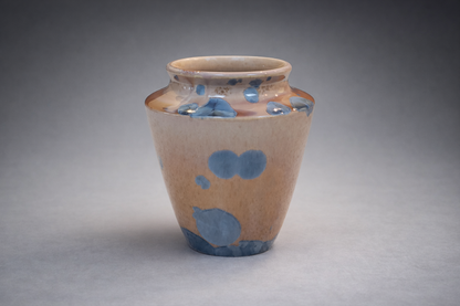 Decorative crystalline glaze vase with soft rounded form and vivid blue crystal patterning