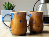 Handmade pottery mug with blue crystalline glaze