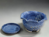 Handmade blue pottery colander bowl with scalloped rim