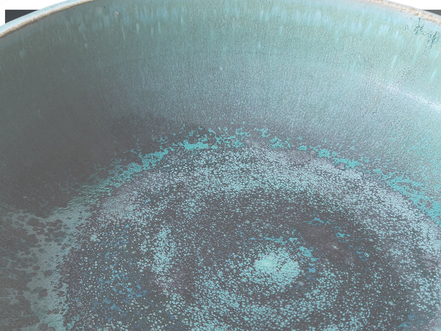 Decorative pottery bowl in soft turquoise glaze for modern tabletop styling