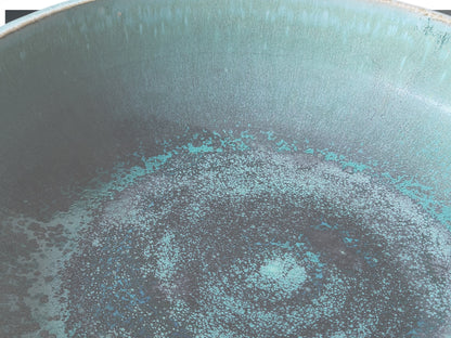 Decorative pottery bowl in soft turquoise glaze for modern tabletop styling