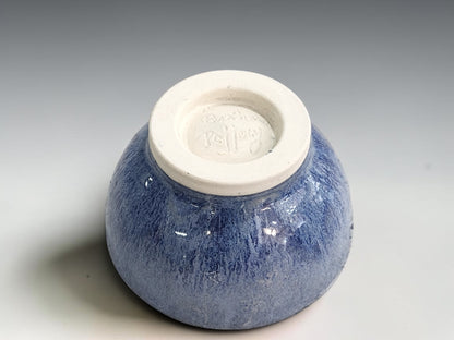 Underside of handmade pottery trinket or condiment bowl in a blue glaze