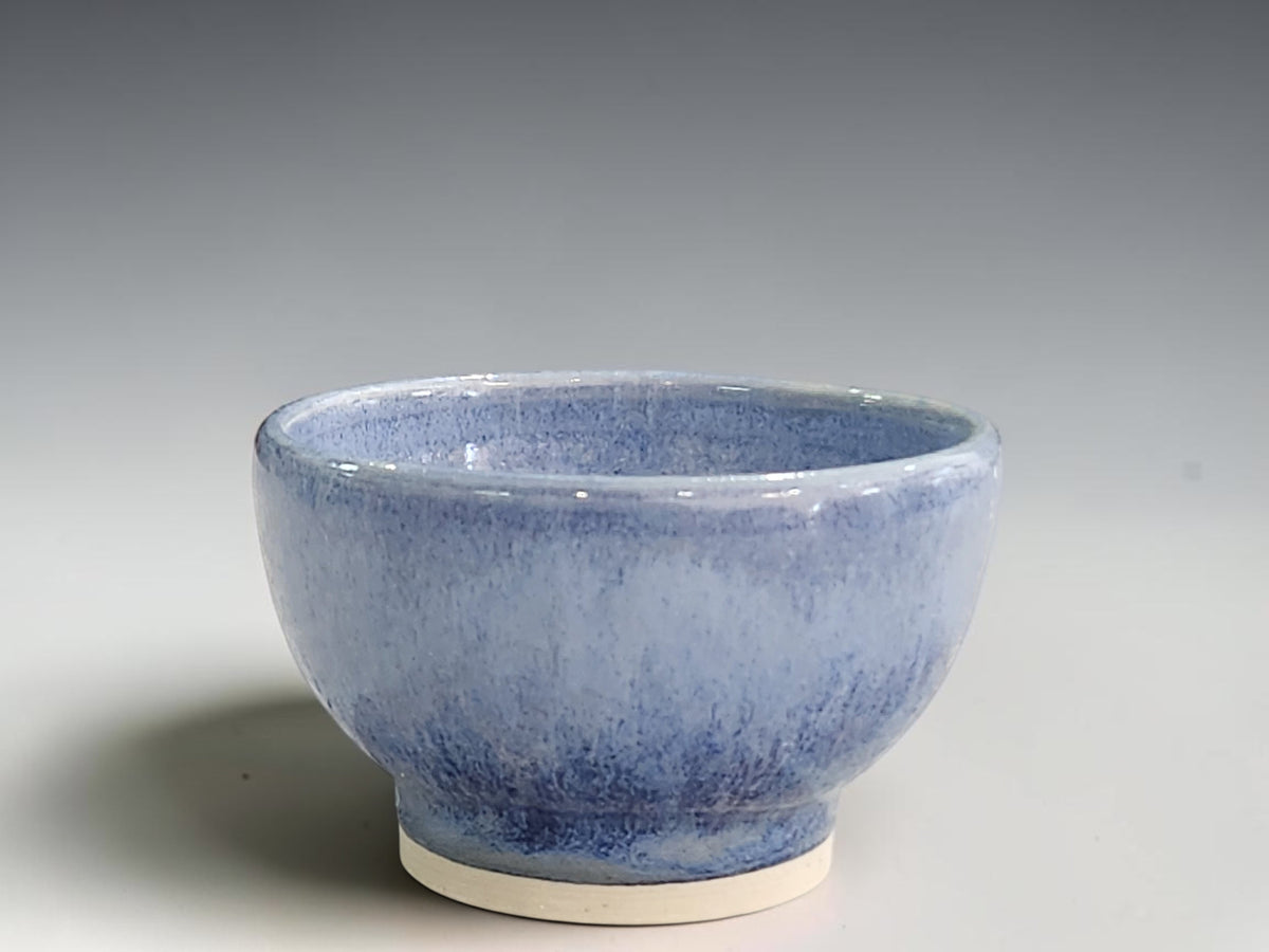 Handmade blue ceramic condiment bowl by Buxton Pottery with mottled glaze and a cream foot.