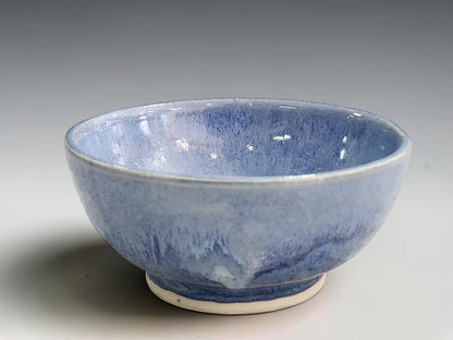 Buxton Pottery blue bowl with a softly rounded shape and an unglazed cream base.