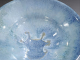 close up of crystalline style glaze handmade ceramic bowl blue tones