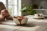 Handmade pottery cereal bowl with speckled cream glaze