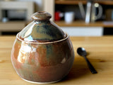 Bronze brown pottery sugar jar with metallic highlights