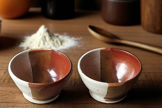 Handmade ceramic condiment bowl in cream and red-brown glaze