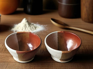 Handmade ceramic condiment bowl in cream and red-brown glaze